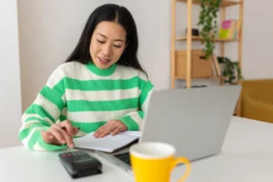 young smiling freelancer asian woman working on la 2023 11 27 05 25 46 utc